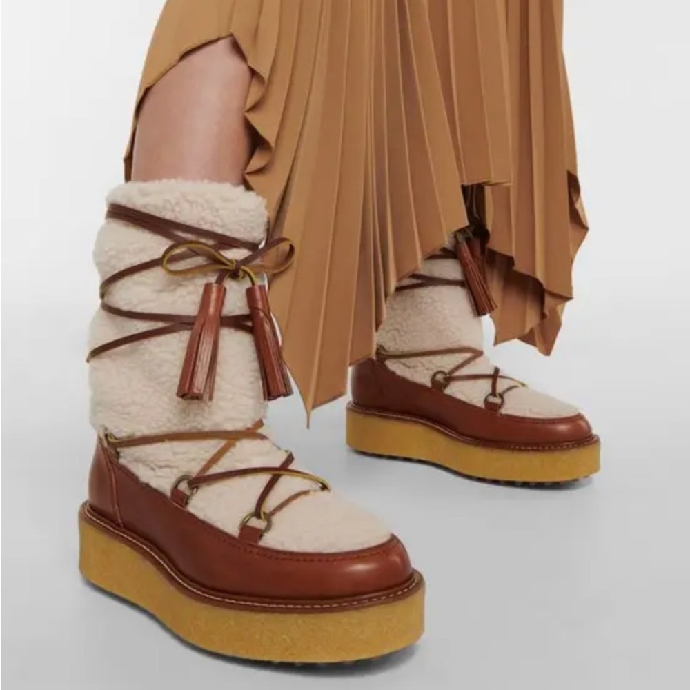 New In Box SOLD OUT TOD'S 
Leather-Trimmed Teddy Snow Boots
$1,095 38 (sz8)